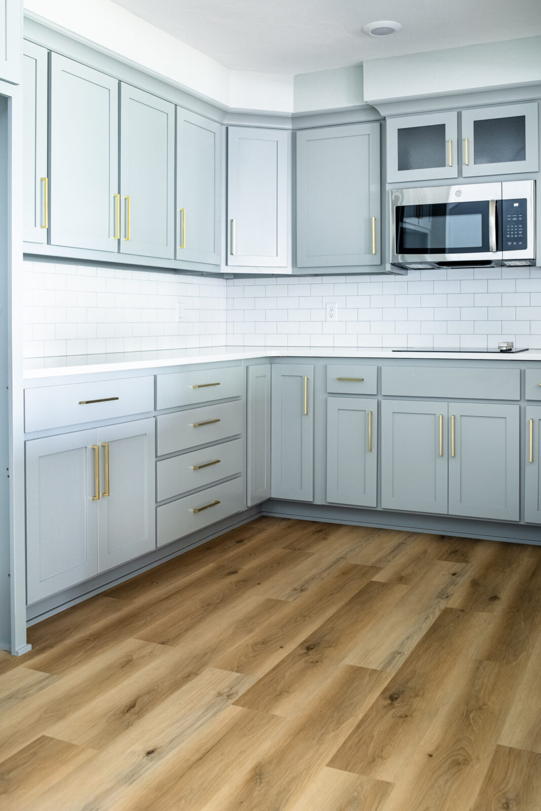 Hardwood floors and white cabinets | Carpetland USA