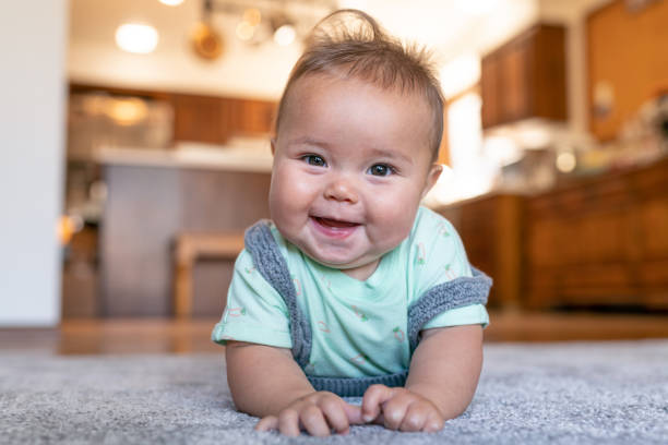 Baby lying on carpet flooring | Carpetland USA