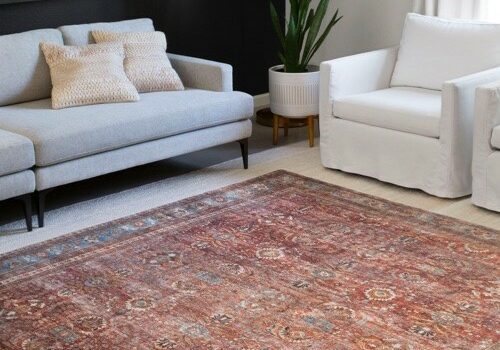 Area rug on carpeted floor | Carpetland USA