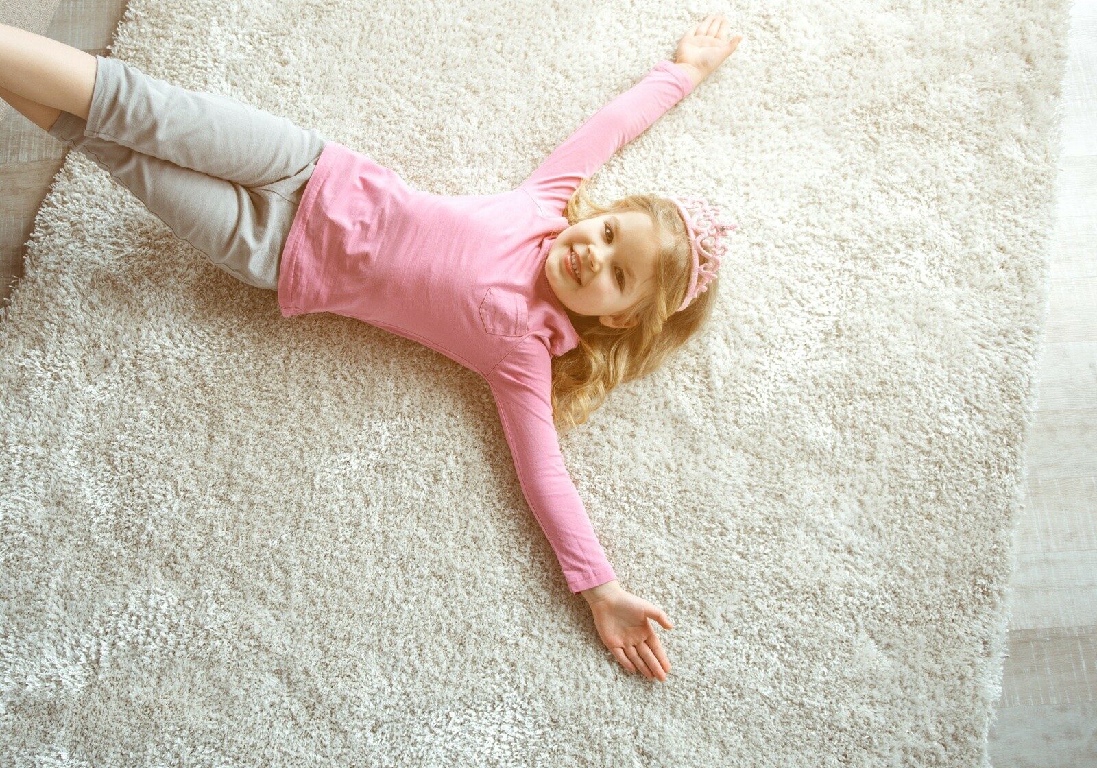 Child lying on carpet | Carpetland USA