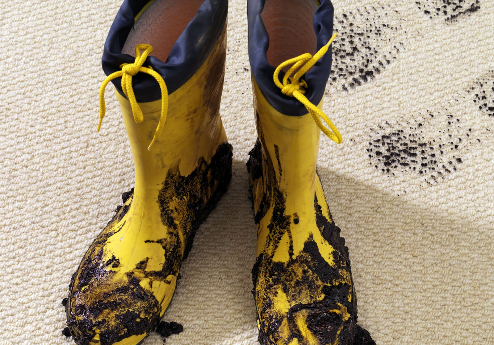Muddy boots on carpeting | Carpetland USA